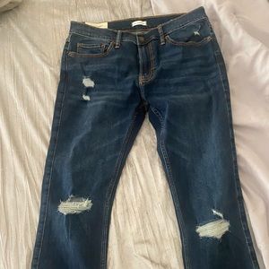 Brand new, tags attached Mens blue jeans with rips